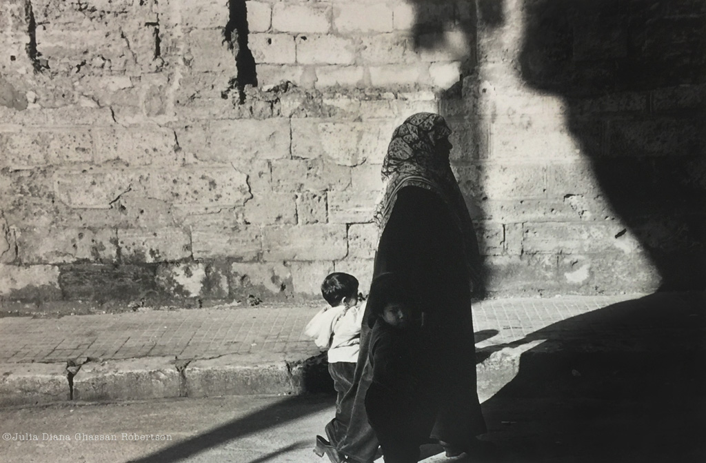 woman in hijab with girl in the shadows, boy in the light, Liban